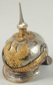 A PRUSSIAN CAVALRY OFFICER'S HELMET with badge and chin strap.