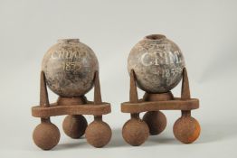 A PAIR OF CRIMEAN CAST IRON POTS, 1855. 30cm.