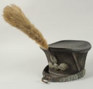 A RUSSIAN BELL TOP SHAKO HAT, circa. 1840 with plume and chin strap.