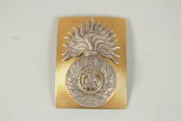 NORTHUMBERLAND FUSILEERS BADGE. 11CM X 8CM.