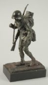 A GOOD CAST BRONZE OF A RUSSIAN SOLDIER on a rectangular base. 22cm high.