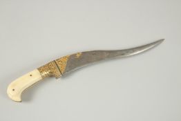 A FINE INDIAN BONE HILTED AND GOLD OVERLAID WATERED STEEL DAGGER, 28.5cm long.
