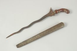 A 19TH CENTURY INDONESIAN - PROBABLY JAVA, KRIS DAGGER, with brass scabbard, 45cm long overall.