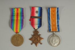WILLIAM ATKINSON. PTE 8518. MANCHESTER REGT. TRIO with ribbons. 1914 Star with bar.