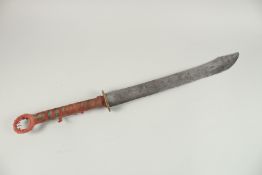 A FINE 19TH CENTURY CHINESE SWORD, with a wide engraved blade and fabric wrapped handle, 84cm long.