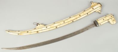A CURVING ISLAMIC SWORD with bone handle and sheath. 90cm long