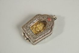 A MINIATURE SILVERED METAL TRAVELLING ICON SHRINE. 4cm.