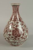 A CHINESE UNDERGLAZE RED AND WHITE PORCELAIN VASE with floral decorations. 31cm high.