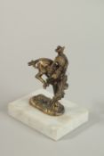 A BRONZE RODEO HORSE AND RIDER CAR MASCOT. Signed, 10cm high.