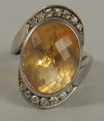 A .925 SILVER TOPAZ RING.