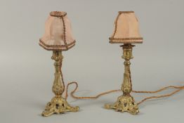 A PAIR OF GILT CANDLE HOLDERS used on the piano at the Savoy Theatre. (see label).