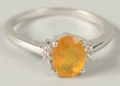 A 9CT WHITE GOLD RING SET WITH AN OVAL CUT FIRE OPAL FLANKED BY WHITE SAPPHIRES. Opal, 1ct approx.