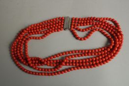 A CORAL BEADED NECKLACE.