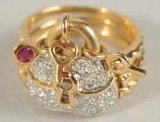 AN 18CT GOLD, DIAMOND AND RUBY RING.