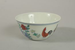 A CHINESE DOUCAI PORCELAIN CHICKEN CUP.