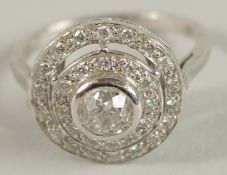 AN 18CT GOLD DIAMOND CLUSTER RING, central stone 1 carat.