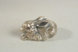 A RUSSIAN SILVER RABBIT with blue eyes. 6cm long. Faberge mark, 60gms.