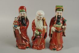 THREE CHINESE PORCELAIN IMMORTAL FIGURES.