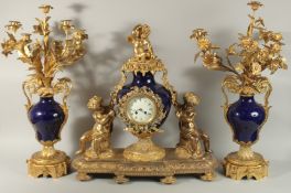 A SUPERB LOUIS XVITH STYLE ORMOLU AND BLUE PORCELAIN THREE PIECE CLOCK GARNITURE. The clock numerals