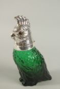 A GREEN GLASS NOVELTY CLARET JUG with silver plated cockatiel head. 25cm high.