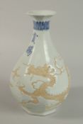 A CHINESE OCTAGONAL PORCELAIN DRAGON VASE. 30cm high.