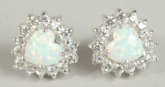 A PAIR OF SILVER AND OPAL CZ EARRINGS