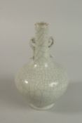 A CHINESE CRACKLE GLAZE TWIN HANDLED BOTTLED VASE. 23cm high/