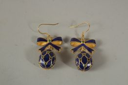 A PAIR OF RUSSIAN SILVER AND ENAMEL EGG AND RIBBON EARRINGS.