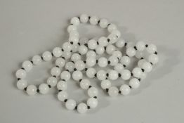 A GOOD STRING OF SEVENTY TWO WHITE JADE BEADS. 70cm long.