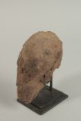A MINERAL SPECIMAN, like a head, 14cm high on a stand.