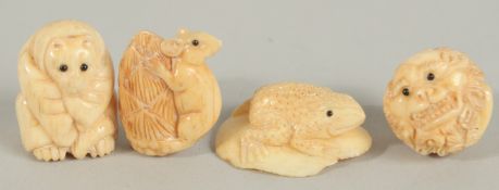 FOUR CARVED BONE NETSUKES.