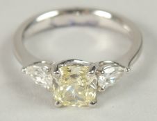A NATURAL YELLOW PEAR SHAPED DIAMOND AND DIAMOND SHOULDERED RING. 1.51 CT CENTRE STONE.