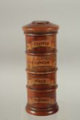 A FOUR DIVISION SPICE TOWER, CLOVES, GINGER, MACE and NUTMEG. 19cms high.