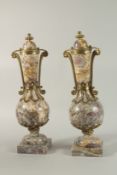 A GOOD PAIR OF VEINED MARBLE AND ORMOLU CASSOLETTES with ormolu mounts on square bases. 52cm high.
