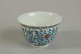 A CHINESE DOUCAI PORCELAIN CUP character mark to the vase. 8cm diameter.