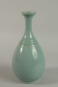 A CHINESE CELEDON GLAZE PORCELAIN VASE, character mark to the base. 29.5cm high.