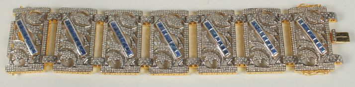 A SUPERB LARGE VICTORIAN STYLE SAPPHIRE AND DIAMOND BRACELET SET IN YELLOW AND WHITE METAL, boxed.