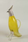 AN AMBER COLOURED GLASS NOVELTY CLARET JUG with silver plated head and feet. 36cm high.