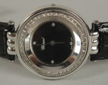 A LADIES CHOPARD 1925 REVERSABLE WRIST WATCH with leather strap. No. 8303. 425.