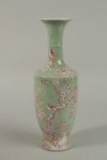 A CELADON CRACKLE GLAZE PORCELAIN VASE with pink prunus blossom, birds and butterflies. 32cm high.