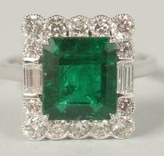 AN 18CT WHITE GOLD RING SET WITH AN OCTAGONAL STEP-CUT EMERALD, surrounded by RBC and baguette cut