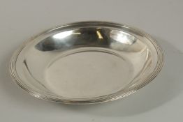 A PLAIN CIRCULAR SILVER DISH. 26ins diameter, 14ozs.
