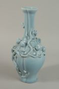 A CHINESE POWDER BLUE PORCELAIN VASE with relief peach blossom. 31cm high.