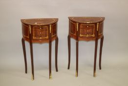A PAIR OF LOUIS XVITH STYLE INLAID DEMI LUNE, TWO DRAWER BEDSIDE CHESTS on curving legs. 58cm