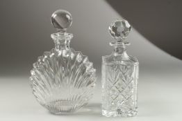 A SQUARE WHISKY DECANTER and stopper and A SMALL DECANTER and stopper.