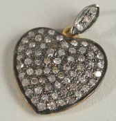 A VICTORIAN DIAMOND HEART SHAPED PENDANT set with rose cut diamonds.