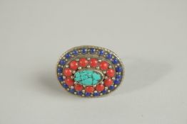 A NATIVE AMERICAN STYLE CORAL AND TURQUOISE RING. 380.