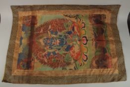 A TIBETAN THANGKA on silk.