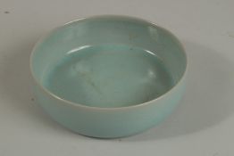 A CHINESE CELEDON GLAZE PORCELAIN BOWL. 16.5cm diameter.