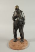 A BRONZE OF AN OLD BEADED MAN on a base. 34cm high.